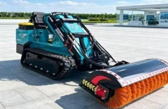 Seated compact track loader with bucket and rubber tracks
