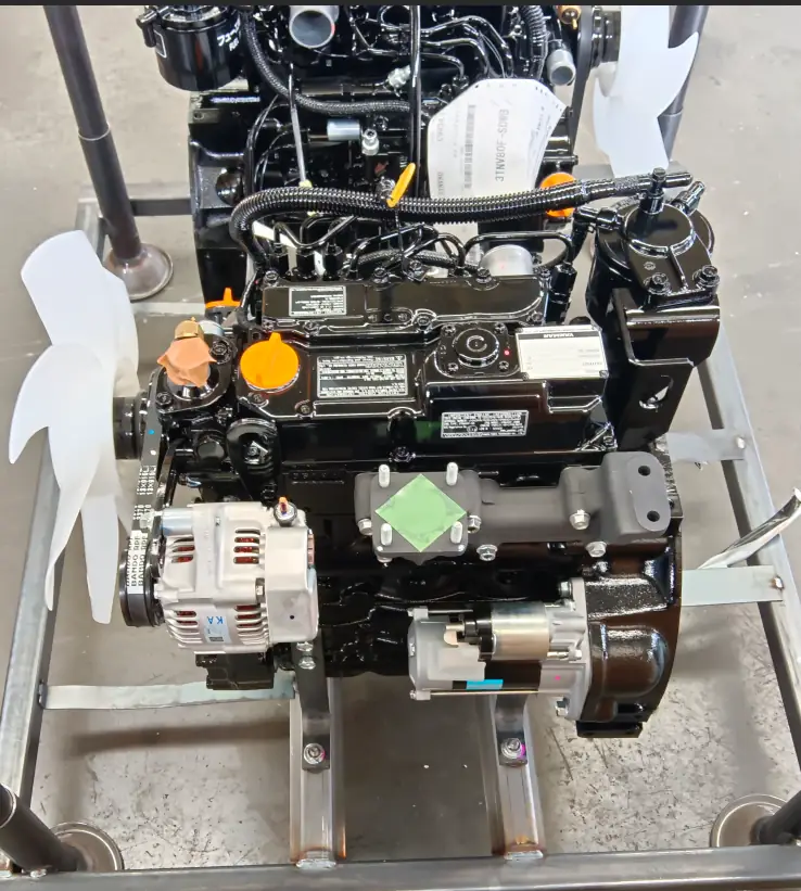Front-view diagram comparing loader body width and standard bucket width