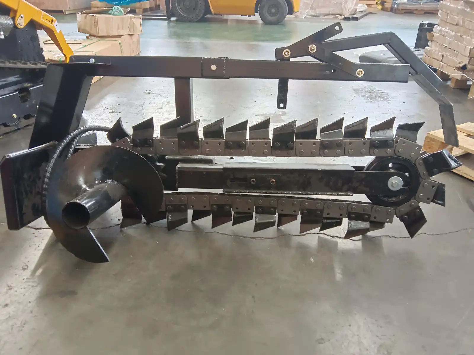 Trencher attachment prepared for skid steer site work