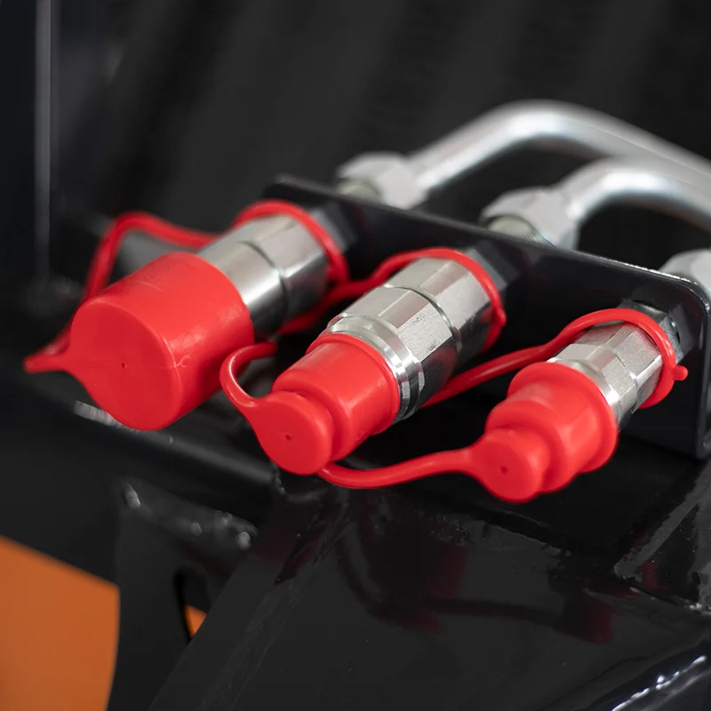 Hydraulic quick couplers on a small skid steer loader