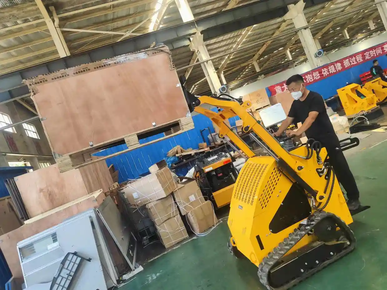Operator performing a pre-delivery function check on a skid steer loader