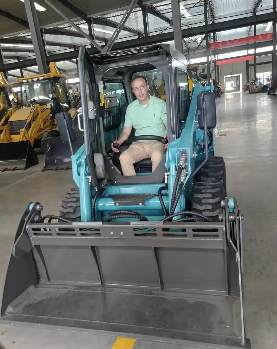Control layout diagram for a stand-on compact loader