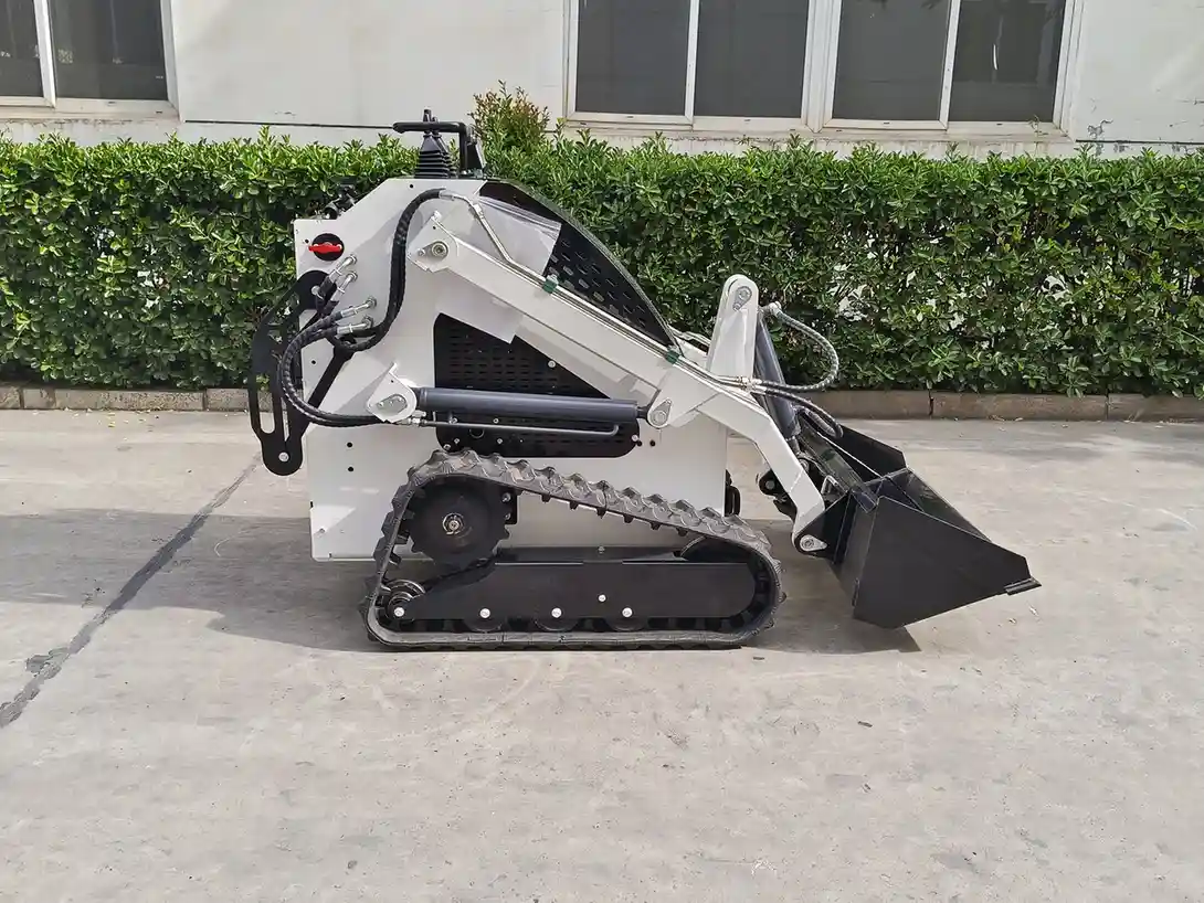 White seated compact track loader viewed from the left side