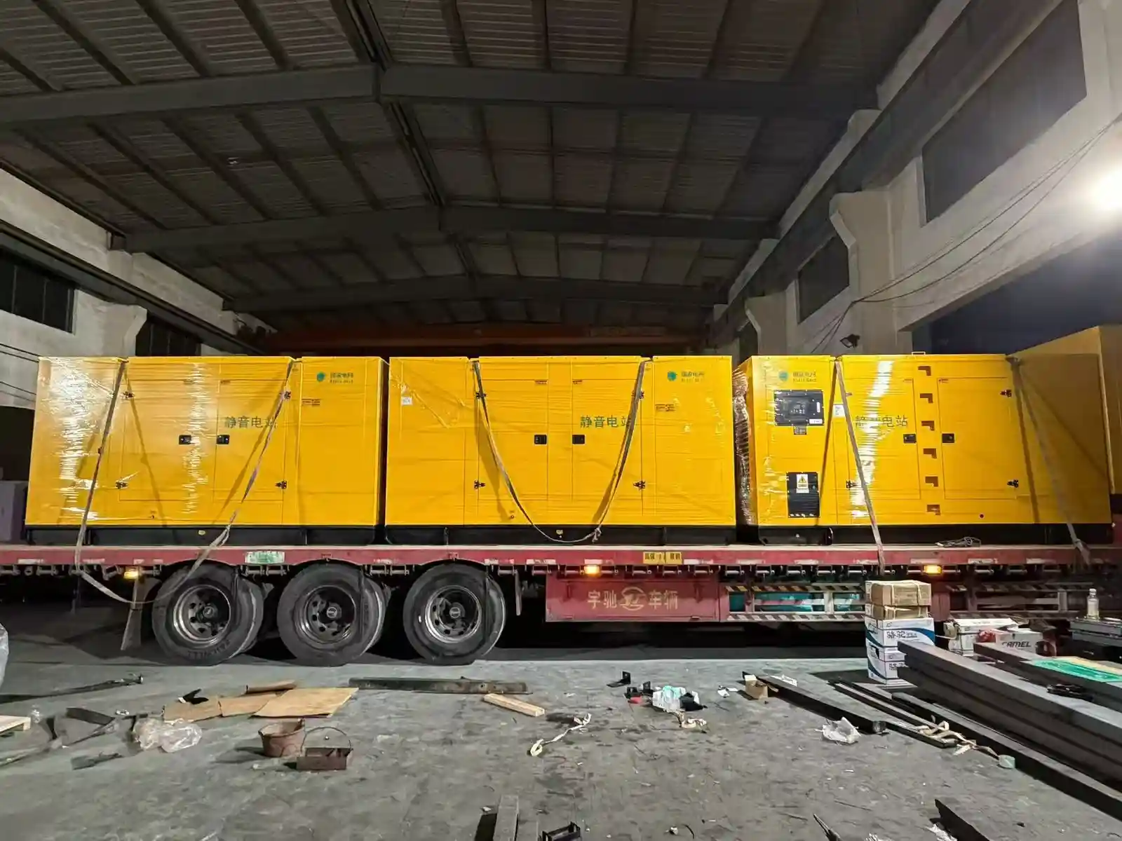 generator set shipping yellow soundproof units on trailer