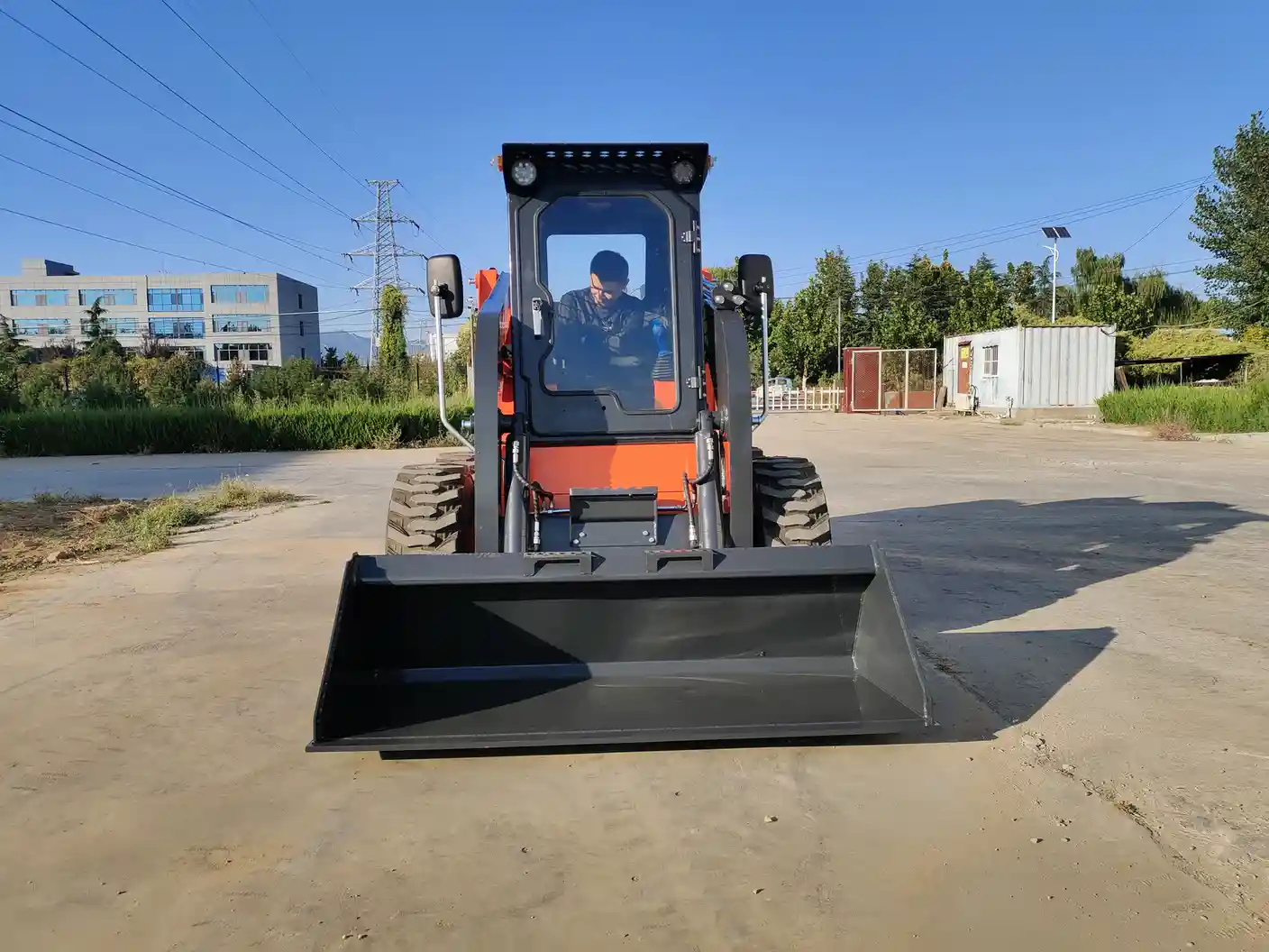 skid steer loader aw65 wheel testing orange front operator